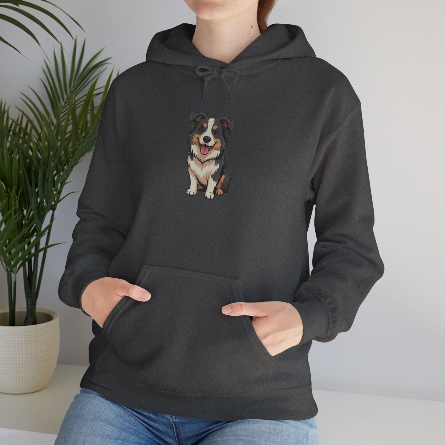 Model leaning against bench wearing dark grey Border Collie dog graphic hoodie – casual novelty pet lover sweatshirt.