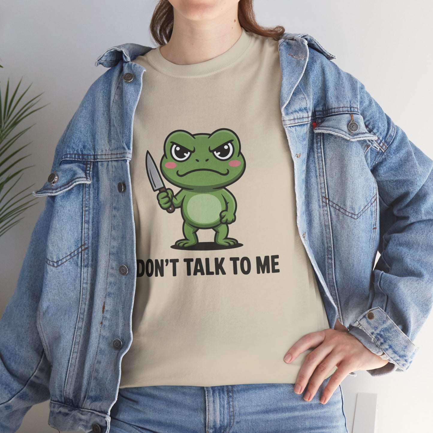 Model in blue denim jacket wearing cream Don’t Talk to Me frog meme shirt – casual novelty graphic t-shirt.