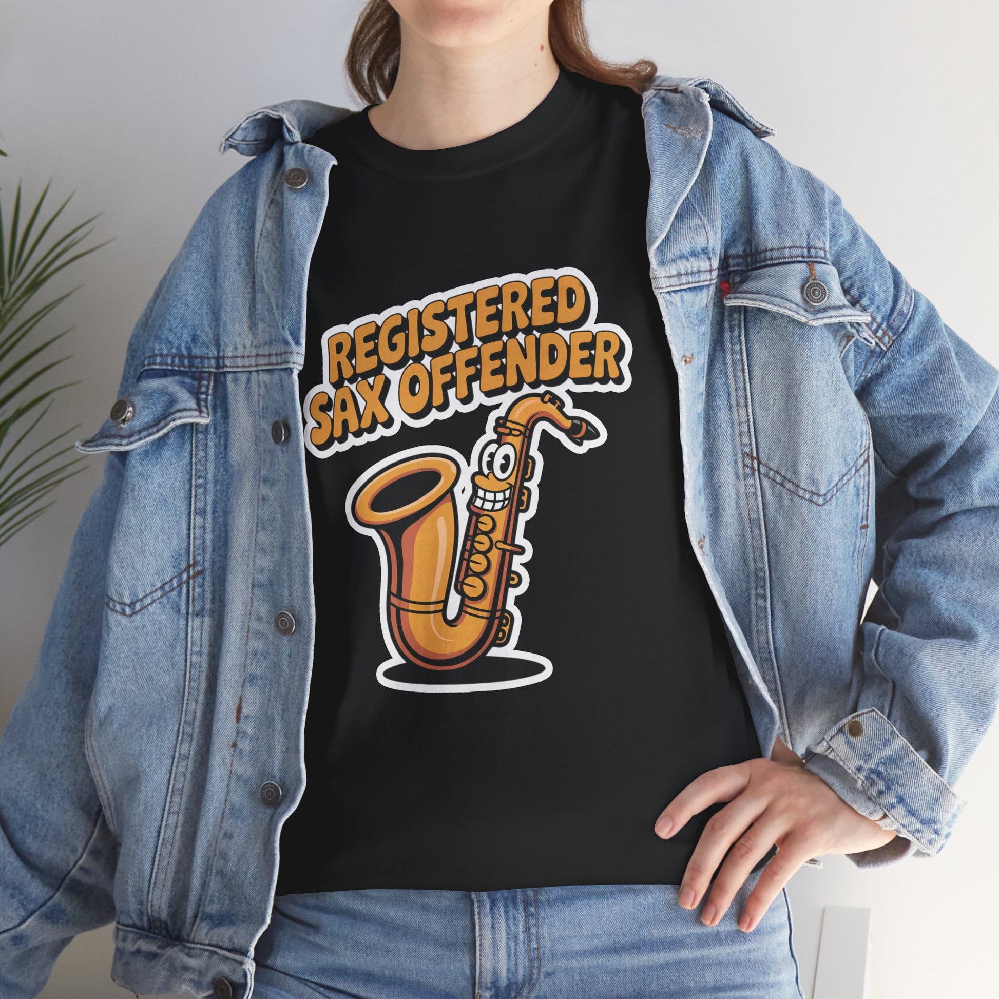 Model in denim jacket wearing black Registered Sax Offender saxophone graphic shirt – casual funny music tee.