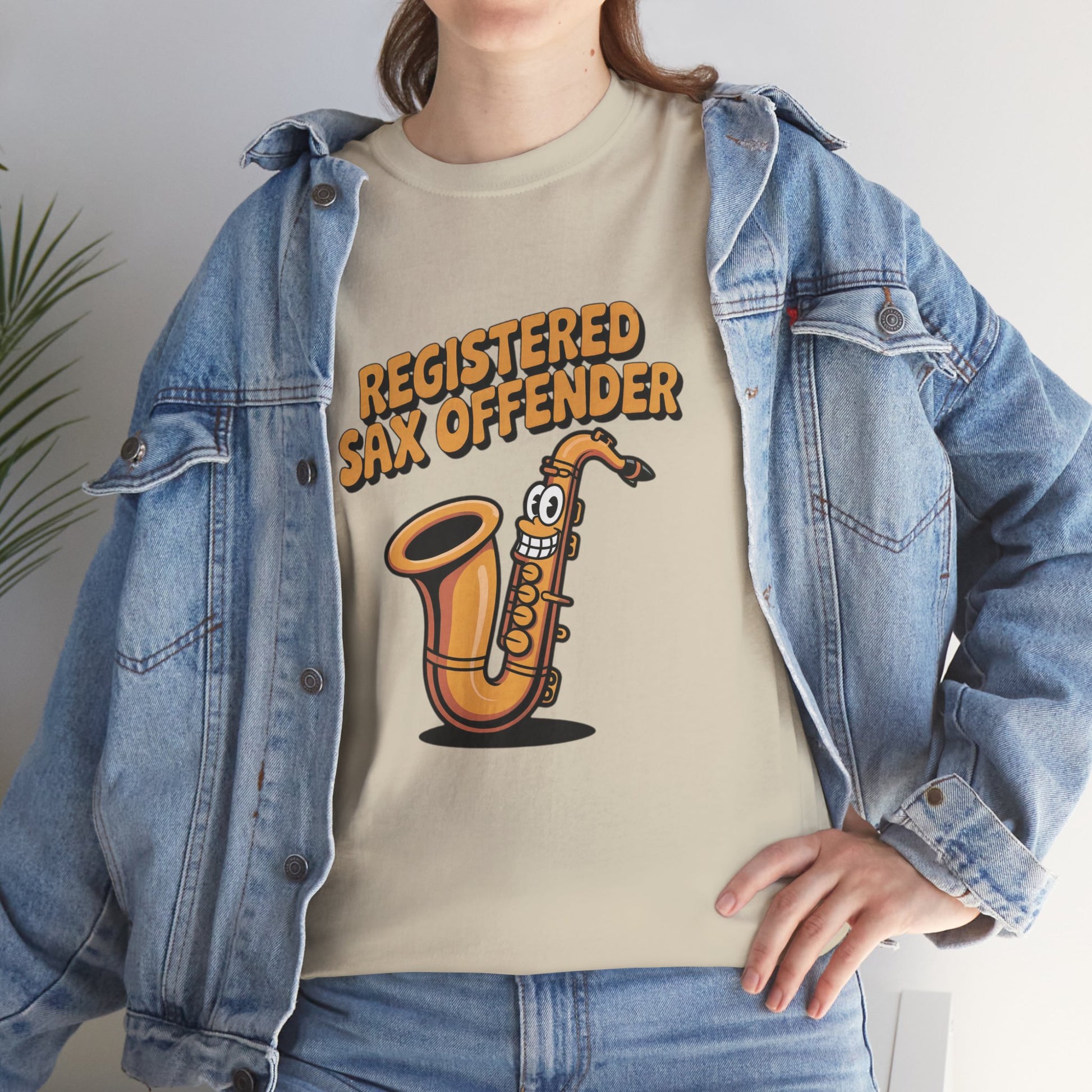 Model in denim jacket wearing cream Registered Sax Offender saxophone shirt – casual novelty parody graphic tee.