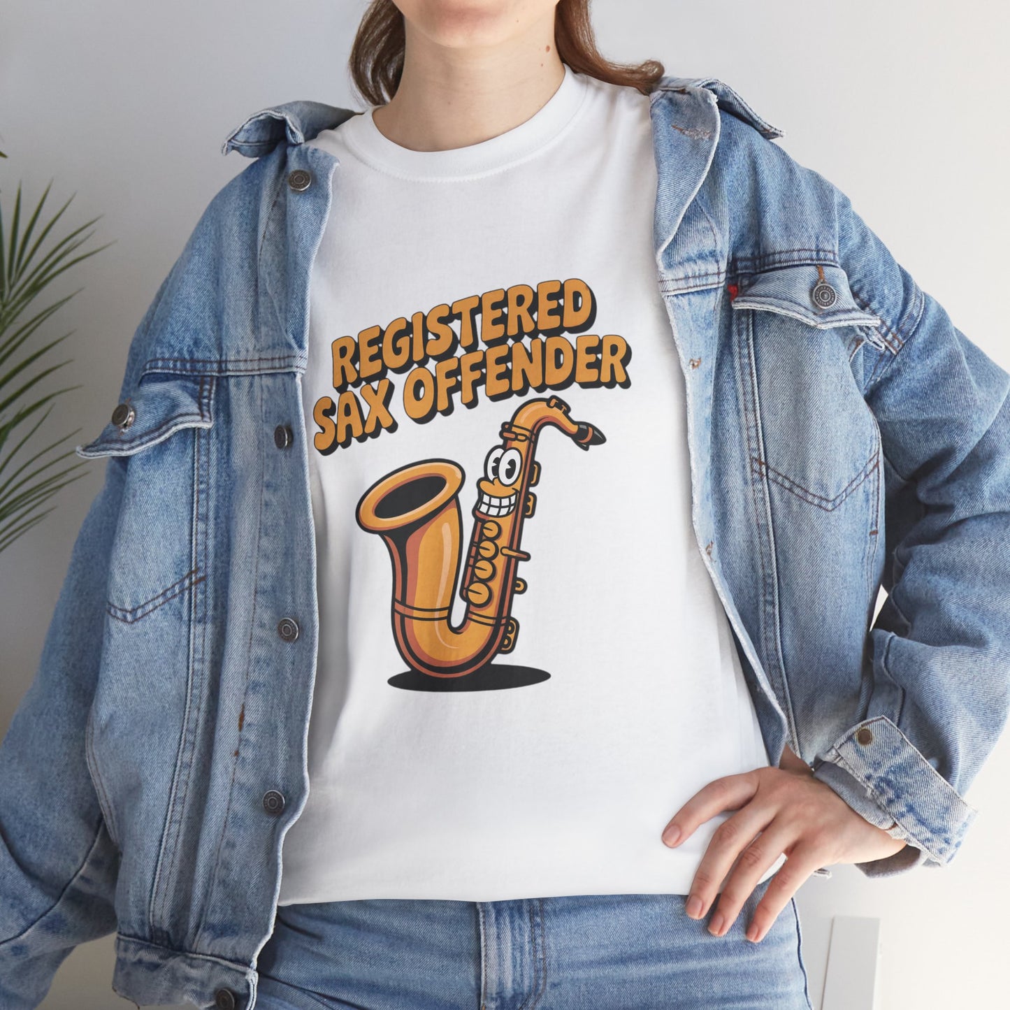 Model in denim jacket wearing white Registered Sax Offender saxophone shirt – casual novelty parody tee.