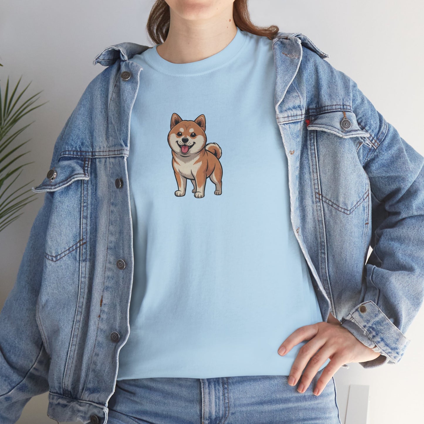 Model in blue denim jacket wearing light blue Shiba Inu dog graphic shirt – casual dog lover t-shirt.