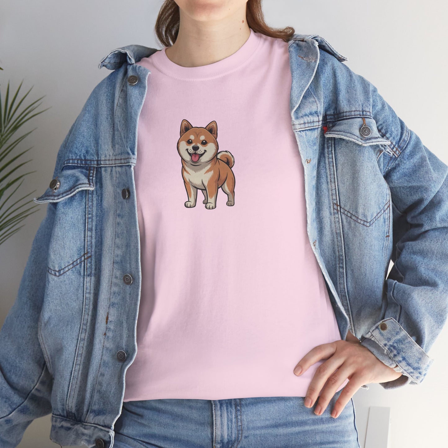 Model in blue denim jacket wearing pink Shiba Inu dog graphic shirt – casual fun dog lover tee.