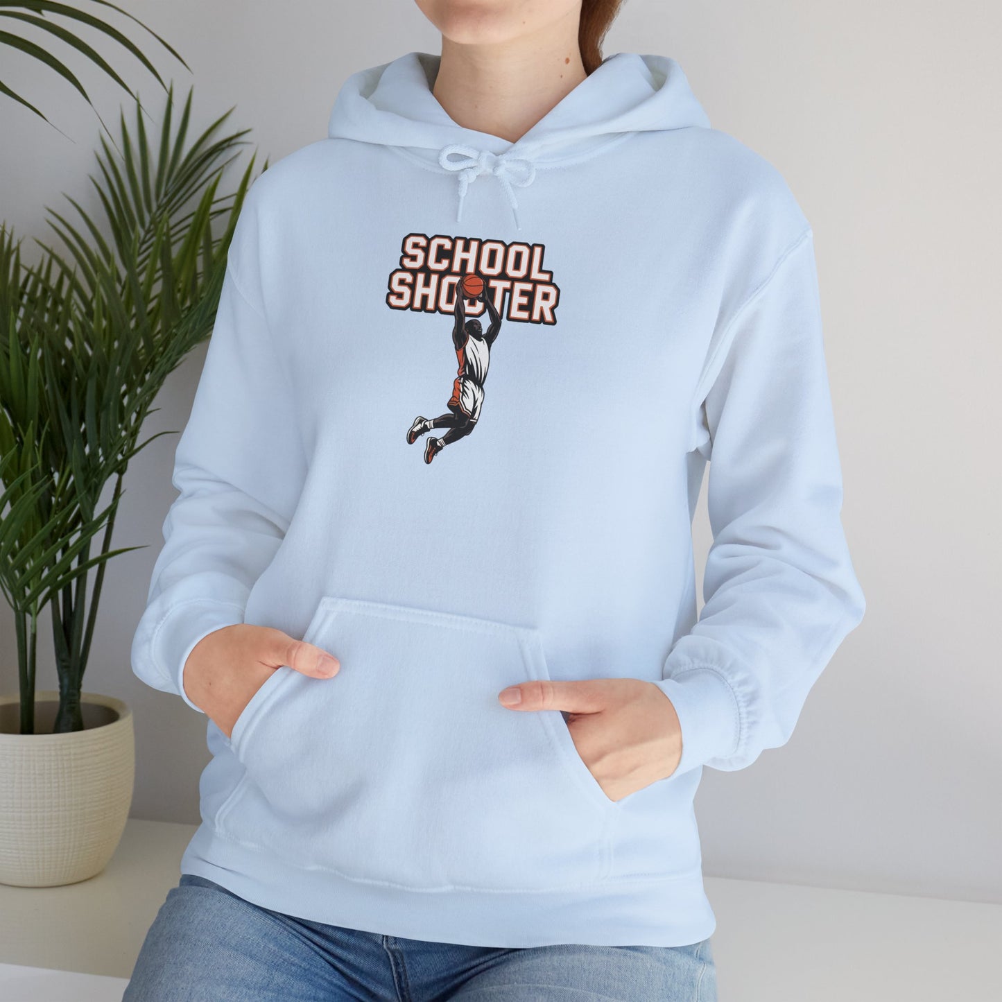 Model leaning against bench wearing light blue Varsity Shooter hoodie – casual novelty varsity parody sweatshirt