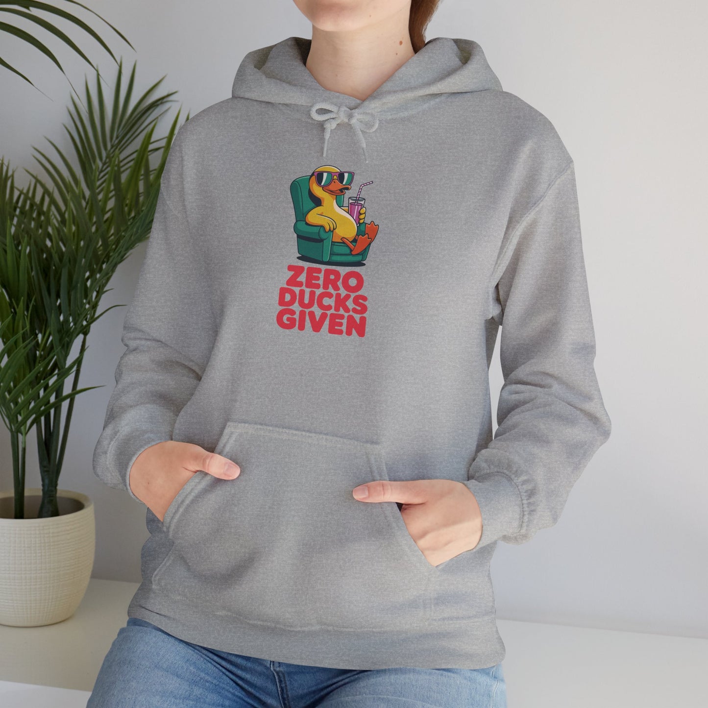 Model leaning against bench wearing grey Zero Ducks Given hoodie – casual funny sarcastic sweatshirt
