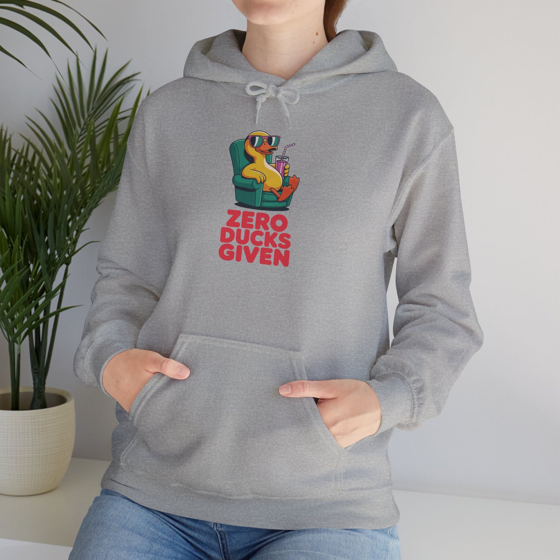 Model leaning against bench wearing grey Zero Ducks Given hoodie – casual funny sarcastic sweatshirt