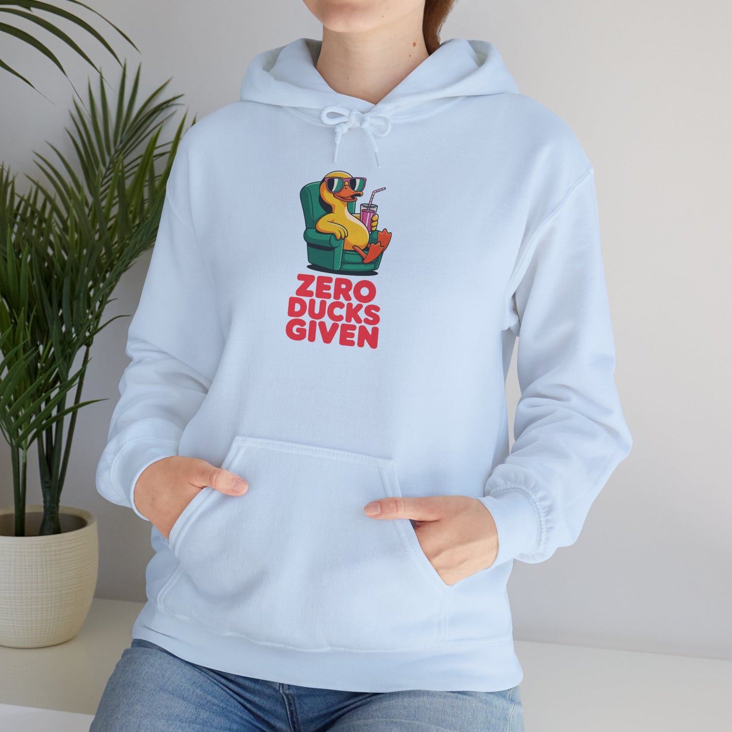 Model leaning against bench wearing light blue Zero Ducks Given hoodie – casual funny novelty sweatshirt