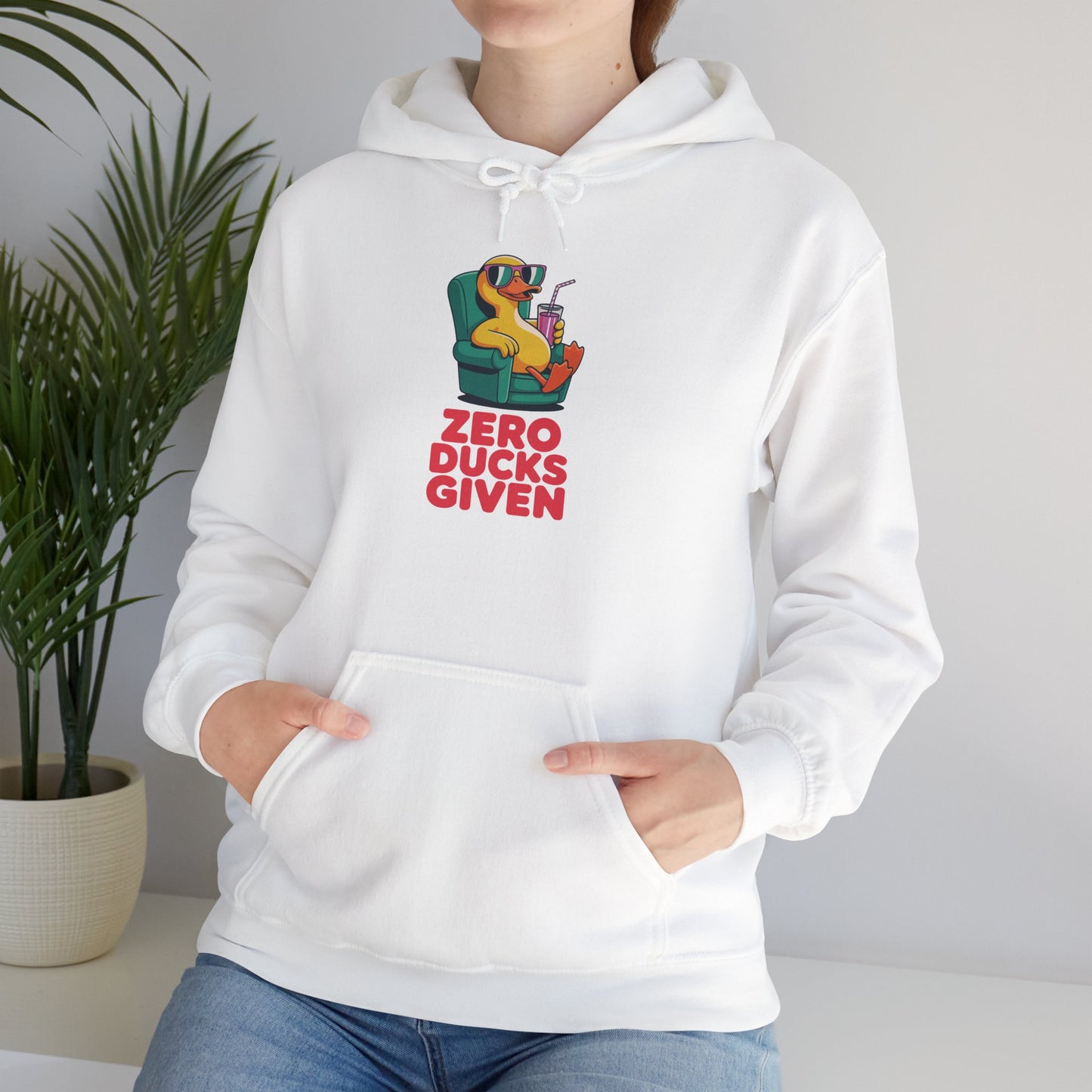 Model leaning against bench wearing white Zero Ducks Given hoodie – casual funny gag gift sweatshirt